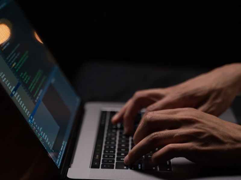 person using silver and black laptop computer